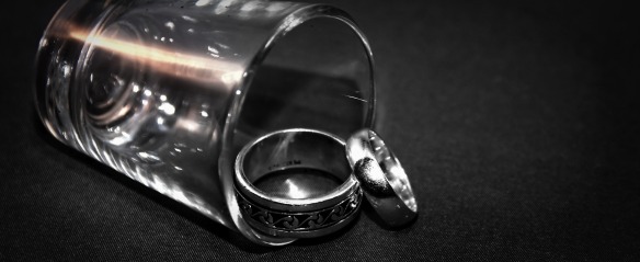 Shot glass with a pair of wedding rings